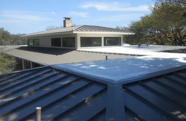 Metal roof panels and transitions on a home