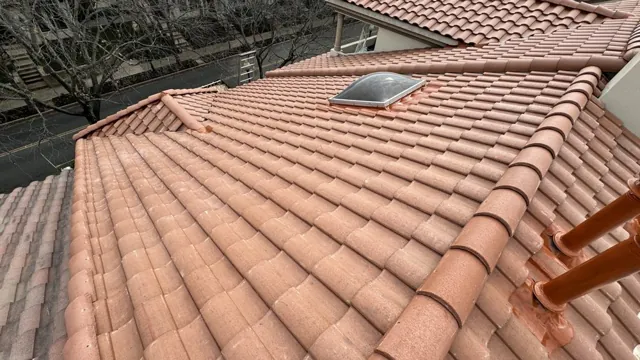 Terracotta roof tiles around a skylight